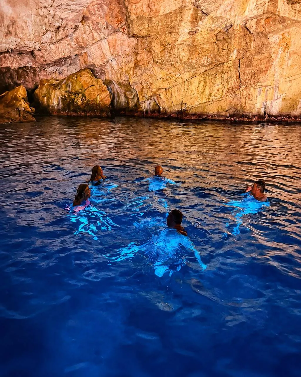Glowing blue water inside the Blue Cave