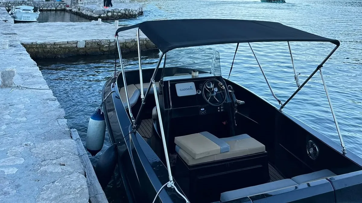 The helm and stern deck of our small speedboat